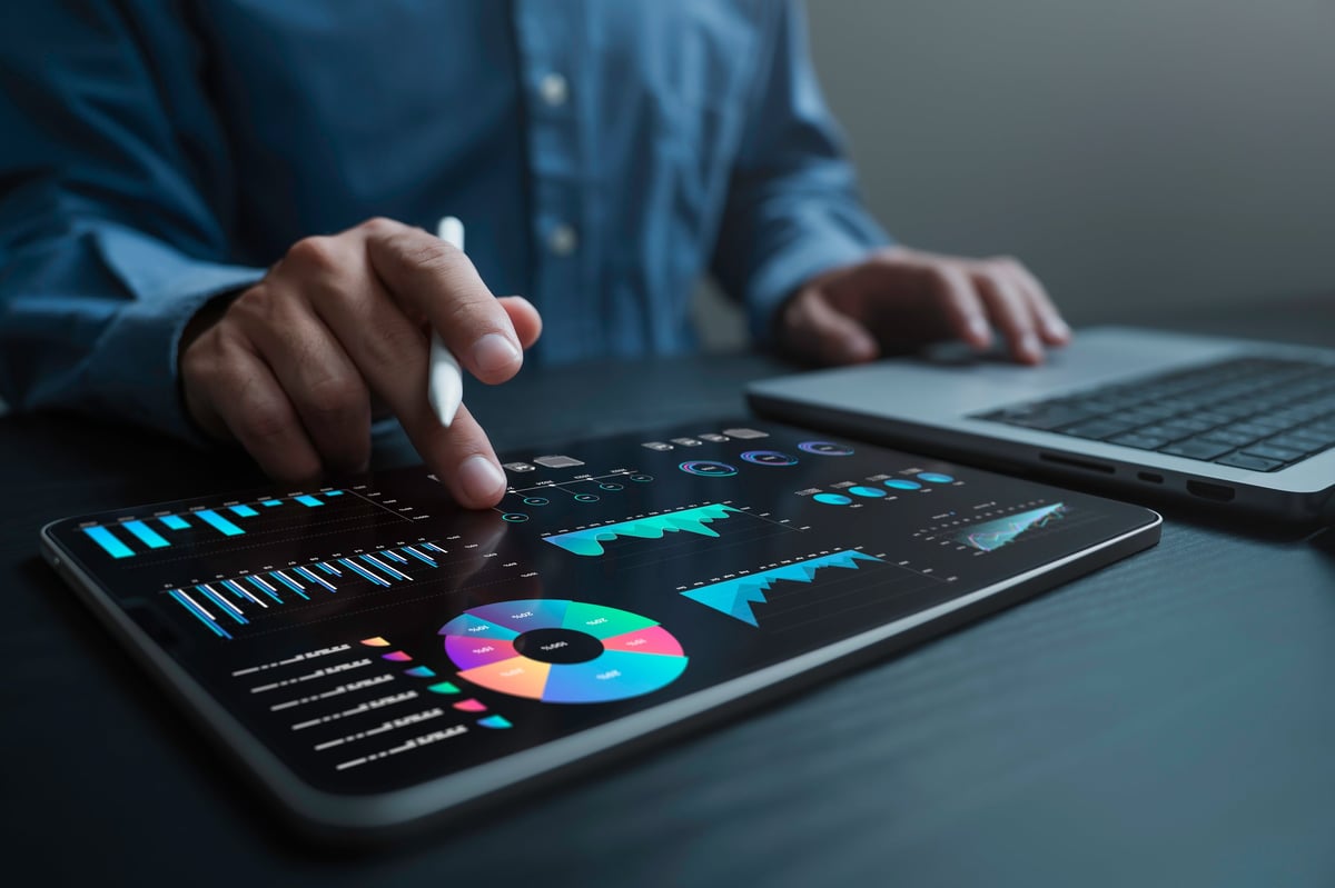 Analyst reviewing royalty accounting data dashboard with KPI metrics for a music distributor