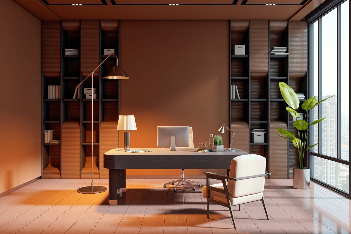 Modern luxury office interior with stylish desk, pc, and armchair, featuring city view through large windows