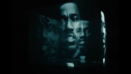 Multiple overlapping male faces in dark teal tones, creating a moody, atmospheric composite portrait effect
